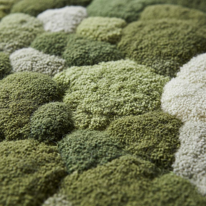 Translation missing: en.Handmade 3D moss rug with green textured pebble design and soft cushioned surface for organic indoor decor