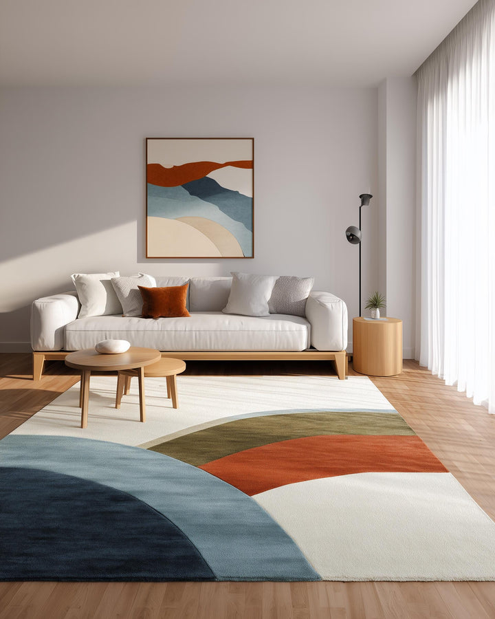 Translation missing: es.Abstract Color Block Rug with curved geometric pattern in terracotta, sage, layered blues, and navy on soft ivory base for modern living spaces