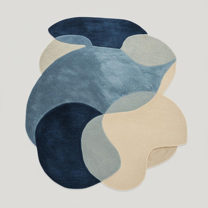 Translation missing: es.Abstract pebble rug with blue and beige freeform shapes and plush cut pile surface