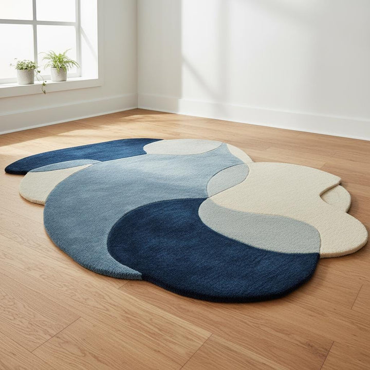 Translation missing: es.Abstract pebble rug with blue and beige freeform design and plush cut pile surface