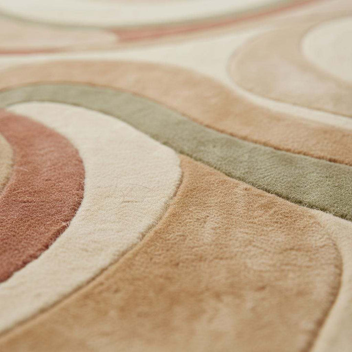 Translation missing: es.Flowing wave design hand tufted rug featuring curved abstract lines in cream, sage green, and terracotta shades