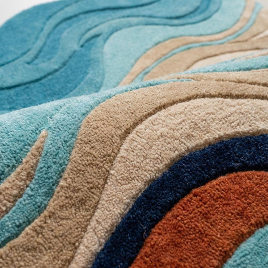 Translation missing: es.Close-up texture of hand tufted wool rug showing carved sculpted wave detailing and soft premium cut pile surface __etsy:8006170588