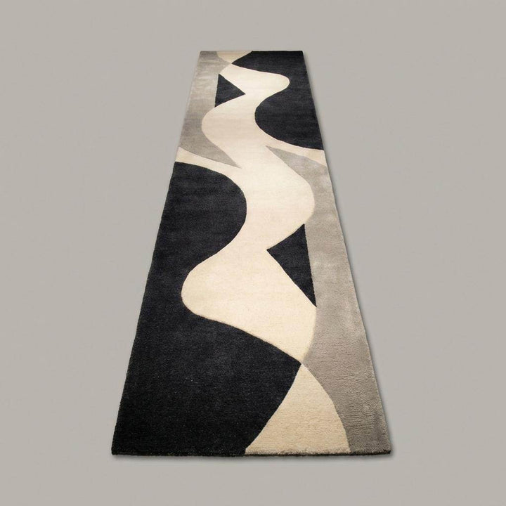 Translation missing: es.Modern abstract runner rug styled in a long hallway, highlighting its narrow shape and mid century aesthetic