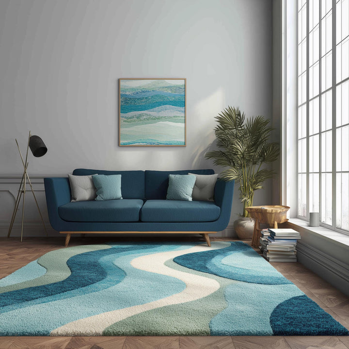 Translation missing: es.Blue wavy abstract area rug with coastal blue and teal waves in a bright living room setting