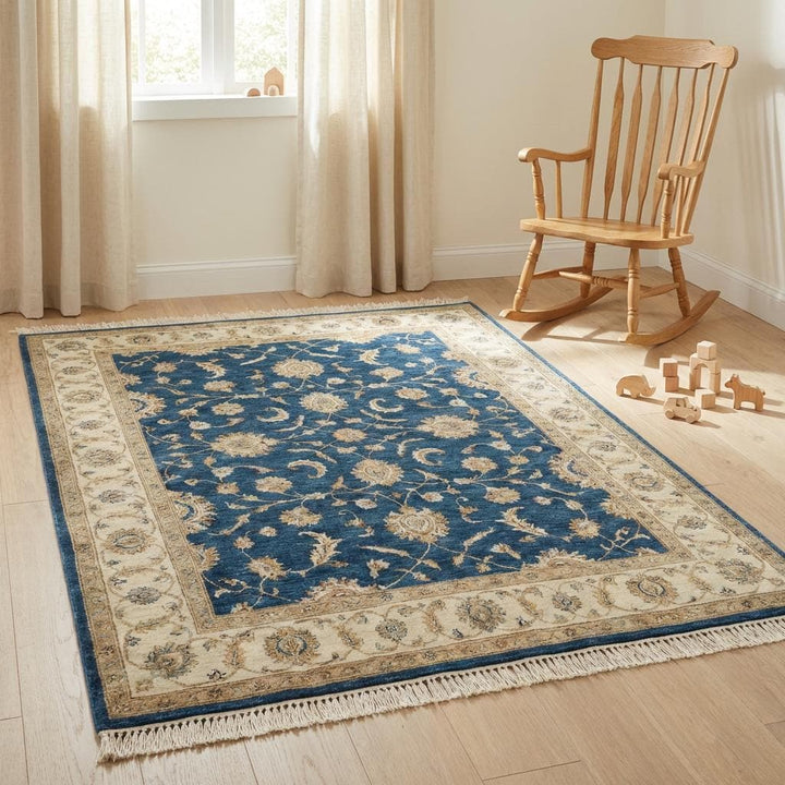 Translation missing: en.Blue and cream hand knotted wool rug styled on hardwood floor
