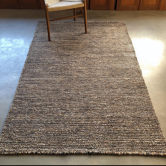 Translation missing: es.Textured wool rug with dense woven pattern in warm neutrals, modern minimalist home décor floor rug under wooden chair