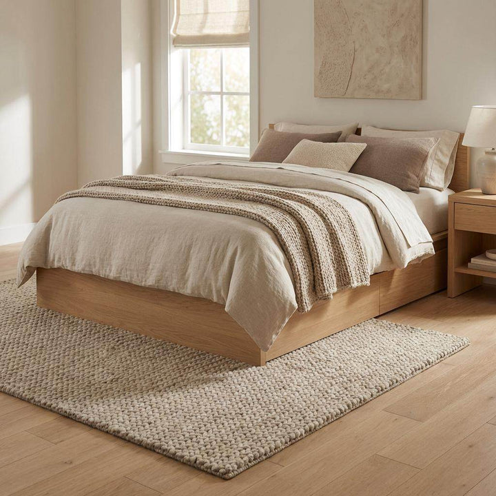 Translation missing: es.Chunky braided knit rug in neutral beige with thick textured yarn for cozy Nordic interiors