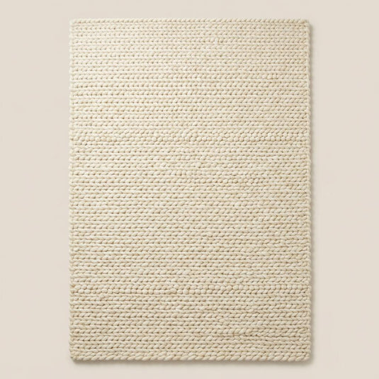 Translation missing: es.Chunky knit area rug with thick textured neutral fibers adding cozy modern organic decor and plush comfort