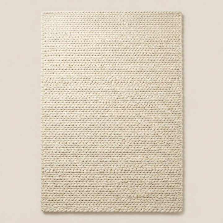 Translation missing: fr.Chunky knit area rug with thick textured neutral fibers adding cozy modern organic decor and plush comfort