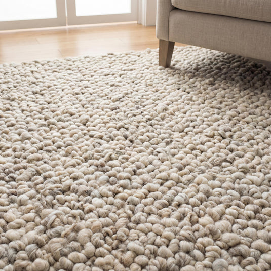 Translation missing: es.Chunky knit area rug with thick wool loop texture in neutral tones for cozy, modern home decor