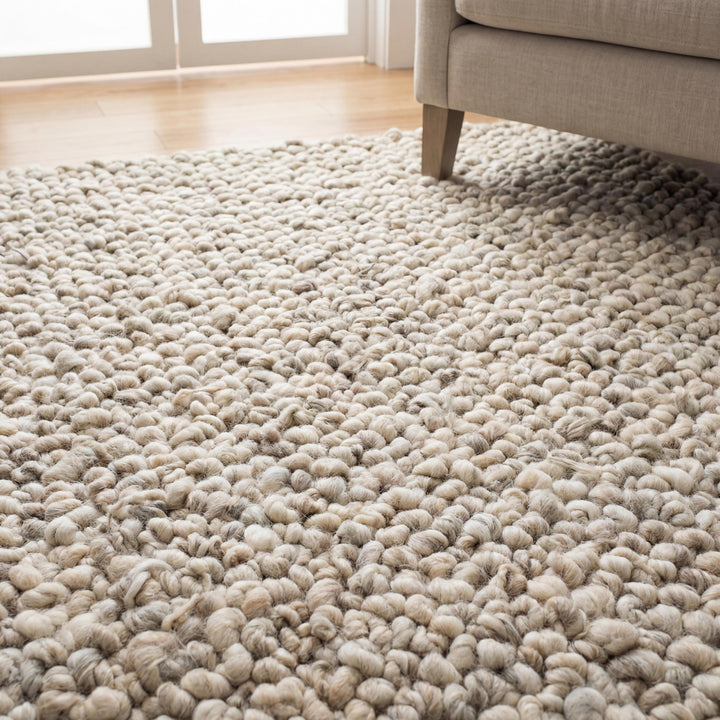 Translation missing: es.Chunky knit area rug with thick wool loop texture in neutral tones for cozy, modern home decor
