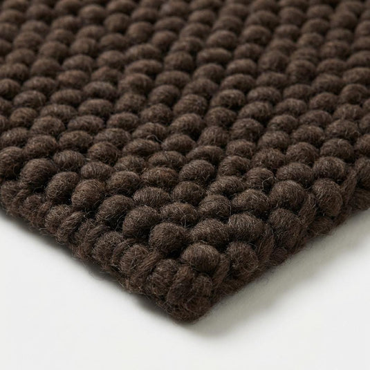 Translation missing: es.Chunky knit rug in dark brown with thick braided roving texture for cozy modern organic interiors