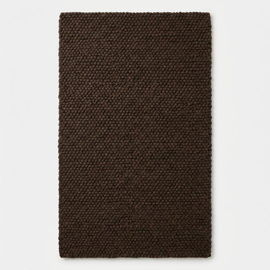 Translation missing: es.Chunky knit rug in dark brown with thick braided roving texture for cozy modern organic interiors