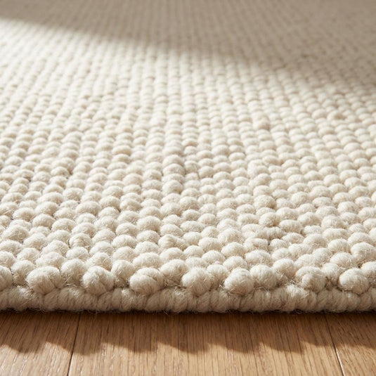 Translation missing: es.Chunky knit wool rug with thick cream looped texture and cozy neutral floor accent