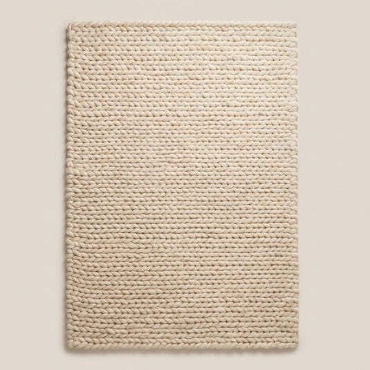 Translation missing: es.Handwoven chunky wool area rug with oversized knit pattern, soft neutral beige rug perfect for modern minimalist interiors