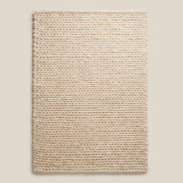Translation missing: es.Handwoven chunky wool area rug with oversized knit pattern, soft neutral beige rug perfect for modern minimalist interiors