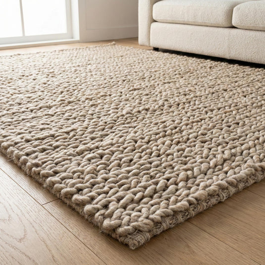 Translation missing: es.Chunky knit wool rug with thick oversized loops, plush texture, and neutral Scandinavian design for cozy home decor