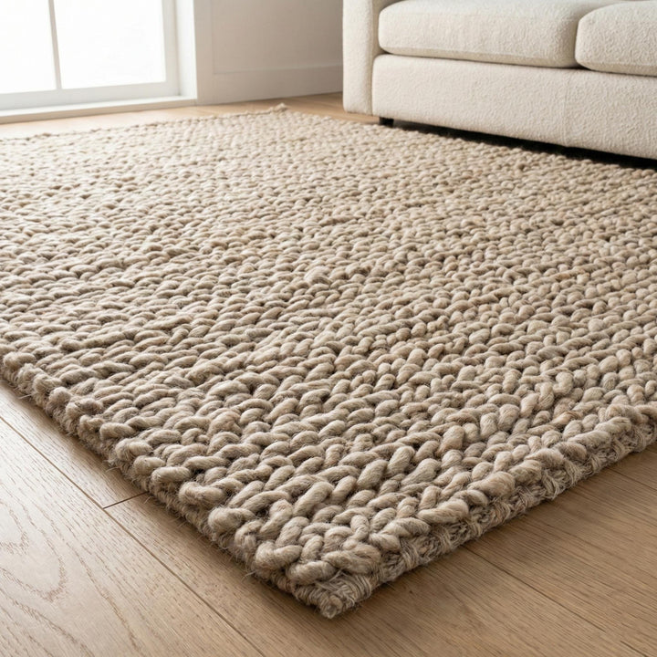Translation missing: es.Chunky knit wool rug with thick oversized loops, plush texture, and neutral Scandinavian design for cozy home decor