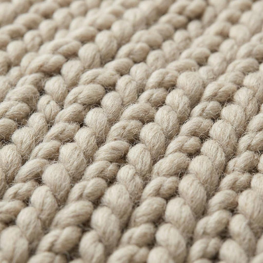 Translation missing: es.Chunky knit wool rug in neutral cream with thick, plush texture for cozy living room decor