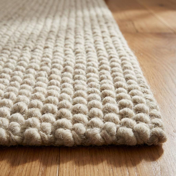 Translation missing: es.Chunky knit wool rug in neutral ivory with thick plush loops for cozy living room décor