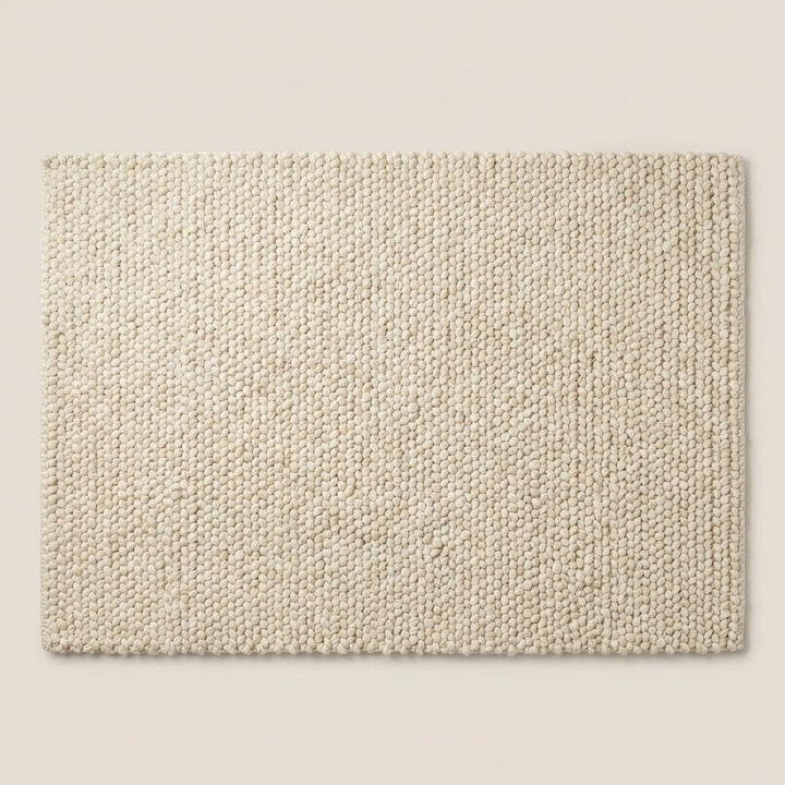 Translation missing: es.Chunky knit wool rug with thick neutral texture for cozy living room or nursery flooring