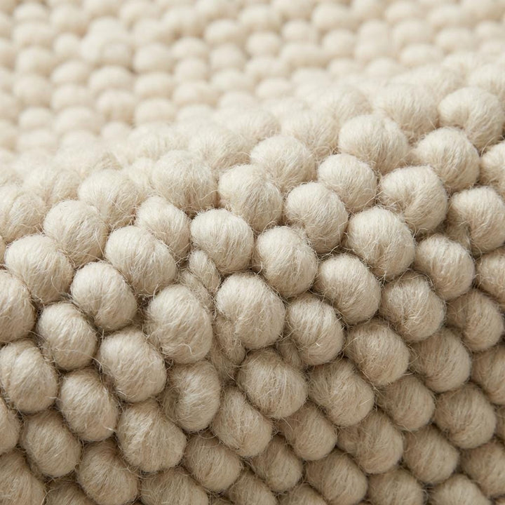 Translation missing: es.Chunky knit wool rug in neutral ivory with thick textured loops for cozy living room or nursery flooring