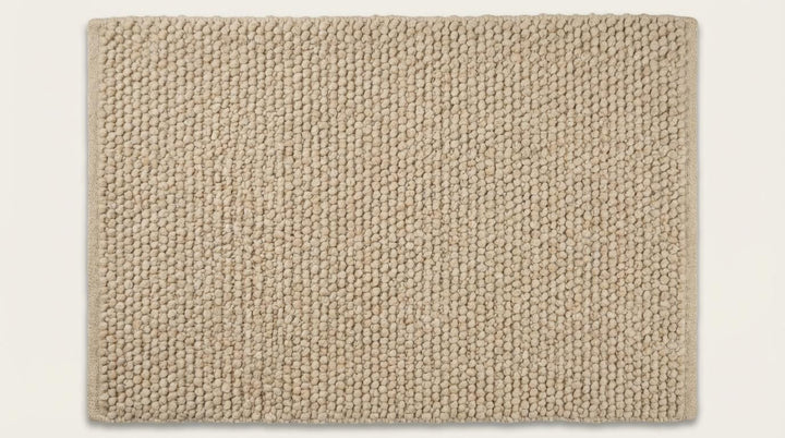 Translation missing: es.Top-down view of textured chunky knit rug with dense woven structure