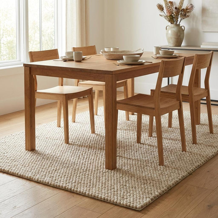 Translation missing: es.Ivory chunky knit wool rug with thick braided texture and soft natural fibers for cozy neutral interiors
