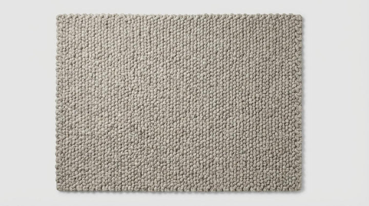 Translation missing: es.Chunky loop rug with thick, plush ivory texture for cozy modern living rooms