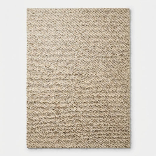Translation missing: es.Top-down view of solid cream chunky loop textured rectangular rug