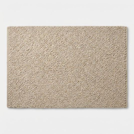 Translation missing: es.Top-down view of dense neutral loop rug showing dimensional surface