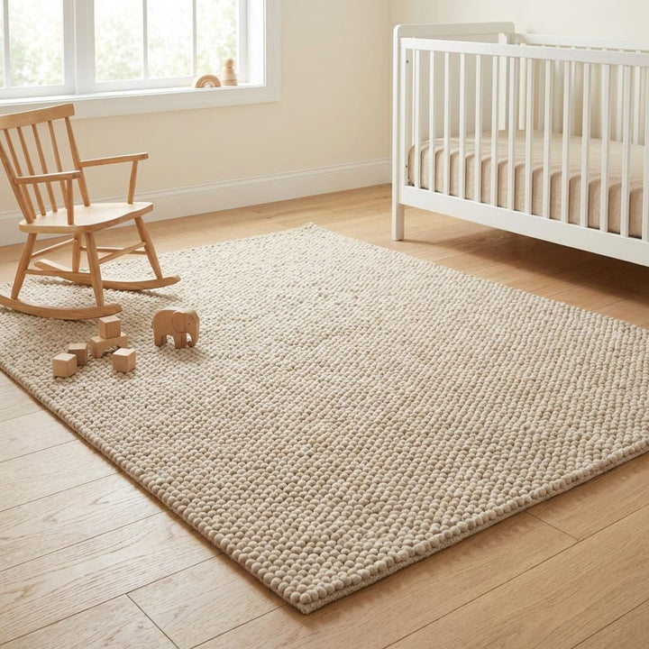 Translation missing: es.Neutral textured rug placed in a minimal modern dining setting with warm wood tones