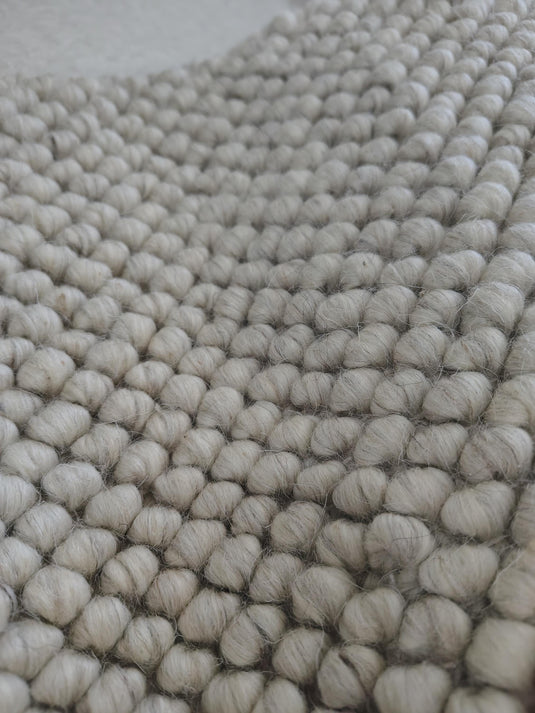 Translation missing: es.Chunky looped ivory rug with thick textured loops and neutral minimalist design for cozy, warm flooring accents