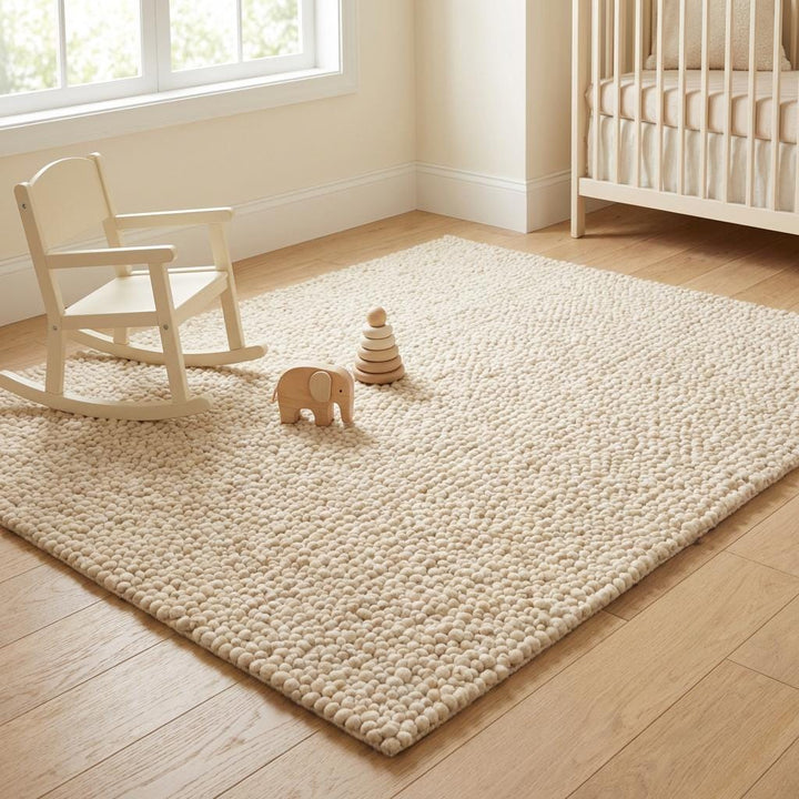 Translation missing: es.Chunky textured neutral area rug with thick looped plush surface in cozy living room setting