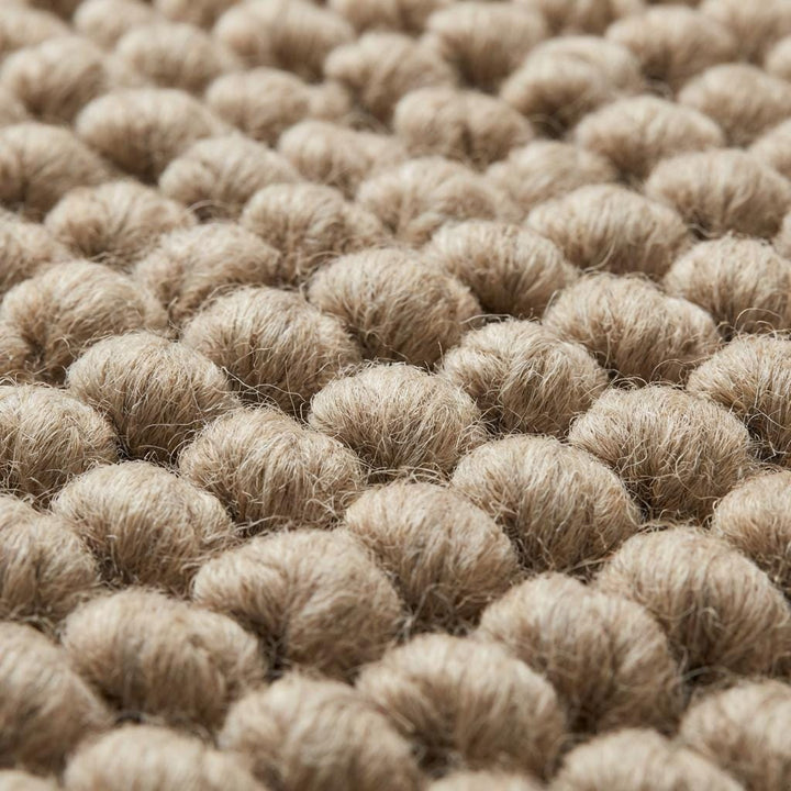 Translation missing: es.Chunky wool area rug with thick, braided neutral beige texture in living room