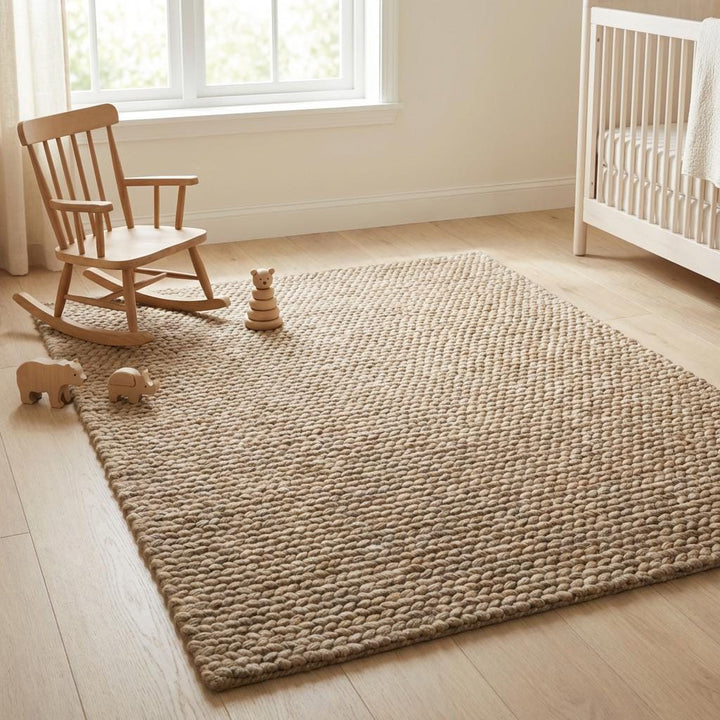 Translation missing: es.Chunky wool area rug with thick braided texture in neutral beige for cozy living room floors