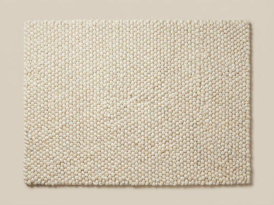 Translation missing: es.Chunky wool ivory area rug with thick textured loops and Scandinavian neutral design