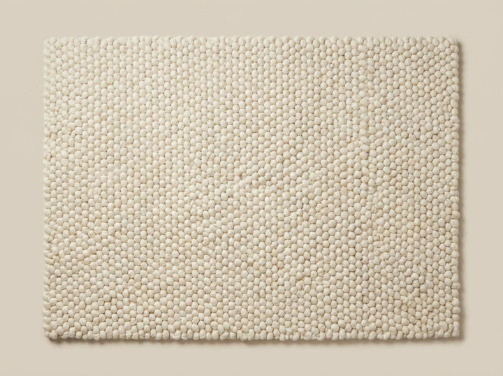 Translation missing: es.Chunky wool ivory area rug with thick textured loops and Scandinavian neutral design