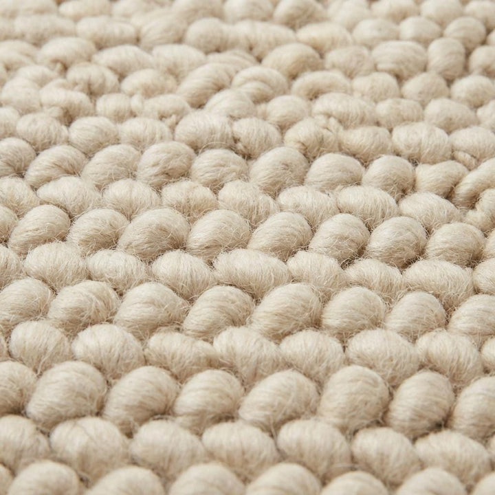 Translation missing: es.Chunky wool loop rug in cream with thick textured yarn loops, handcrafted cozy area rug for modern organic interiors