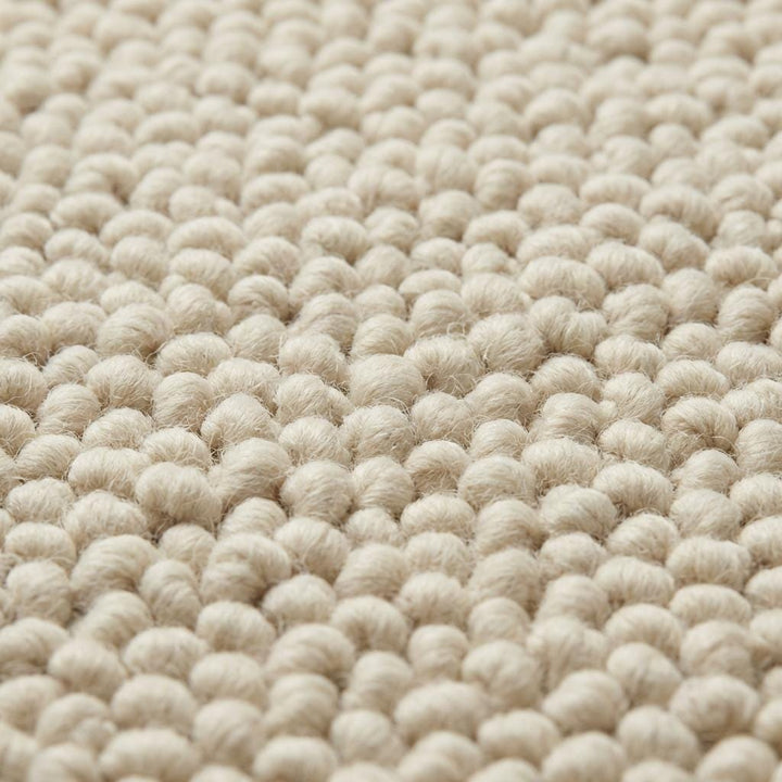 Translation missing: es.Chunky wool loop rug in cream with oversized textured loops and plush neutral design for cozy hygge decor