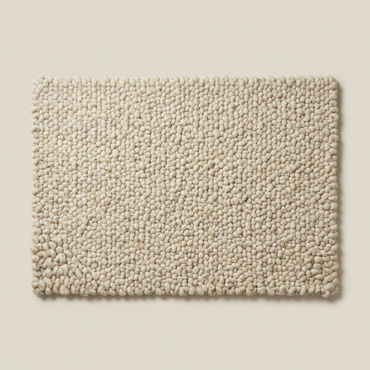 Translation missing: es.Handcrafted chunky wool loop rug in cream with thick textured loops for cozy, plush neutral area decor
