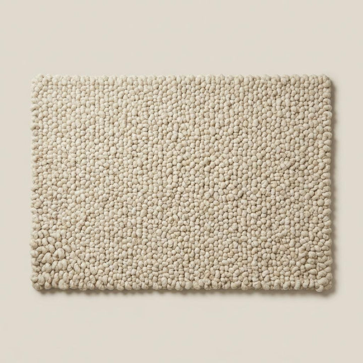 Translation missing: es.Handcrafted chunky wool loop rug in cream with thick textured loops for cozy, plush neutral area decor