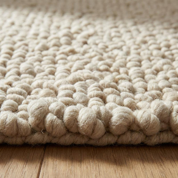 Translation missing: es.Handcrafted chunky wool loop rug with thick cream texture for cozy neutral decor