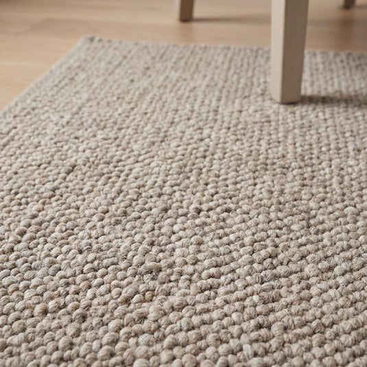 Translation missing: es.Chunky wool loop rug in neutral beige with thick textured weave for cozy Scandinavian home decor