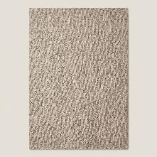 Translation missing: es.Top-down view of solid neutral chunky rug showcasing full texture and looped weave pattern, minimalist beige area rug with thick woven construction