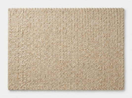 Translation missing: es.Top-down view of textured neutral chunky knit area rug