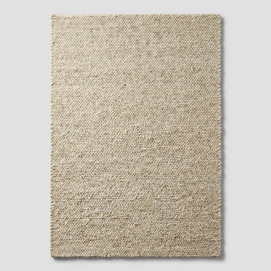 Translation missing: es.Top-down view of chunky loop cream rug