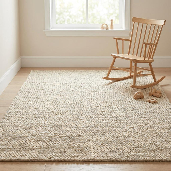 Translation missing: es.Soft textured rug styled for a serene nursery space