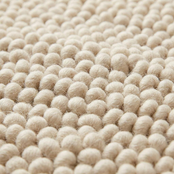Translation missing: fr.Chunky wool pebble rug in thick ivory with textured loops for cozy modern living rooms