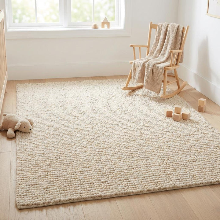 Translation missing: fr.Chunky wool pebble rug with thick ivory textured loops for cozy modern living room ambiance